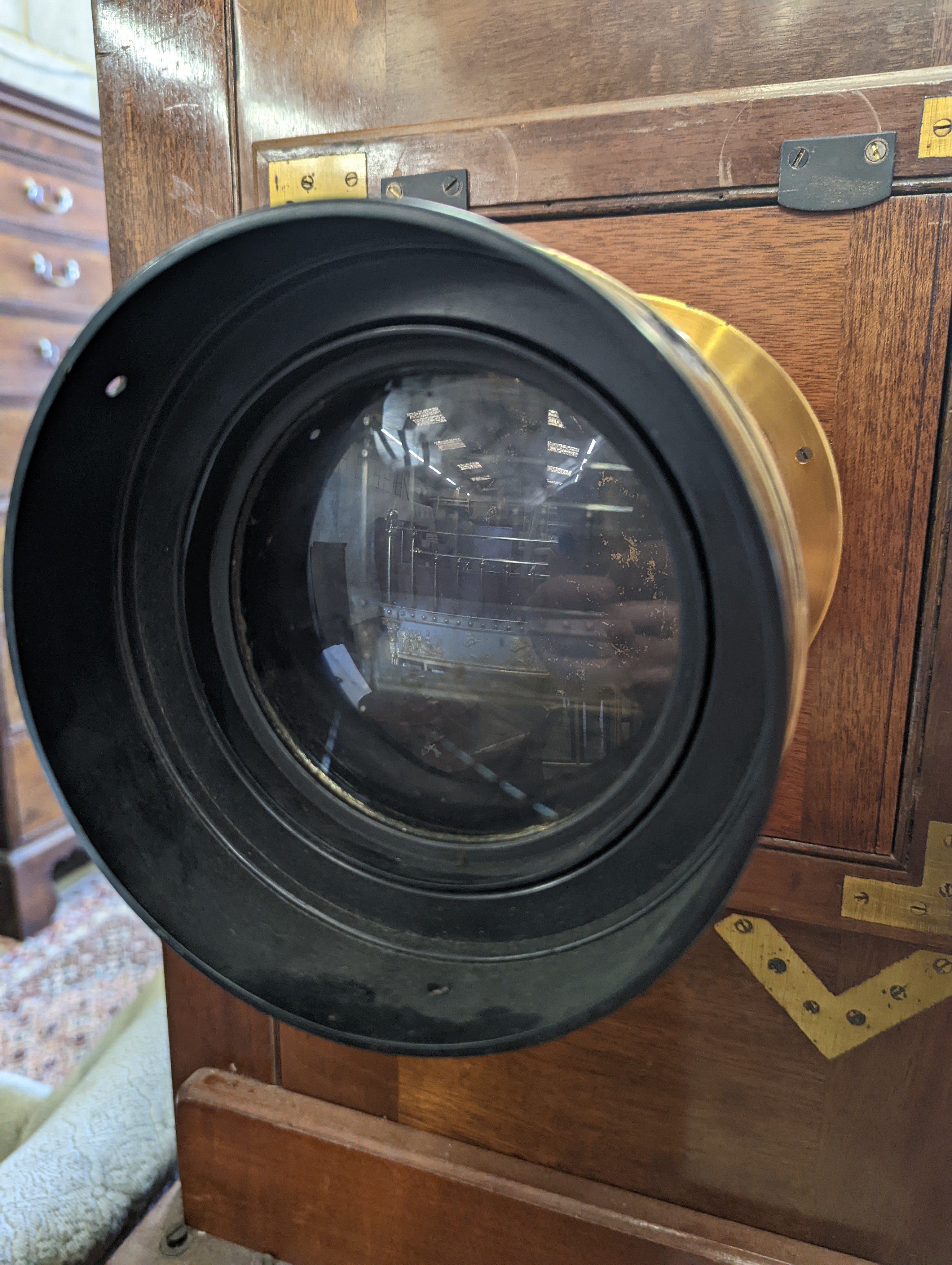 An early 20th century Hunter-Penrose Ltd. brass mounted mahogany studio plate camera, with 4in. lens, height 78cm, width 49cm
